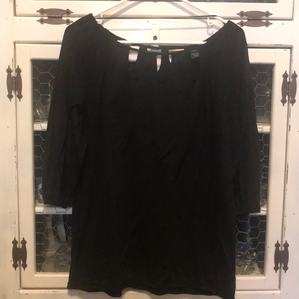 Black faded glory shirt, peep hole neck line.